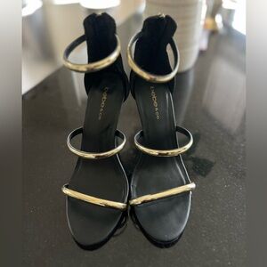 Bebe Berdine Heels. Black/gold. Heel height 4.25-4.5” (see pics). Size 8.
